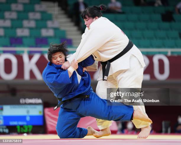 Akira Sone of Team Japan and Iryna Kindzerska of Azerbaijan compete in the Women's +78kg semi final on day seven of the Tokyo 2020 Olympic Games at...