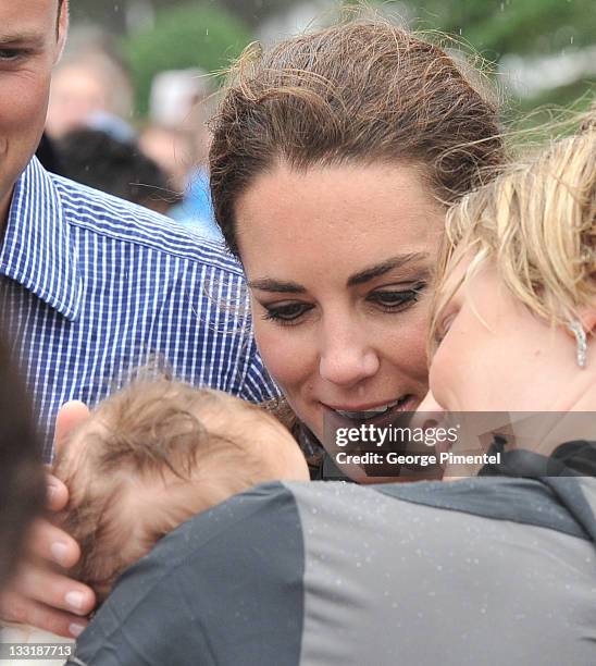 Catherine, Duchess of Cambridge arrives on shore after rowing dragon boats across Dalvay lake on July 4, 2011 in Charlottetown, Canada.