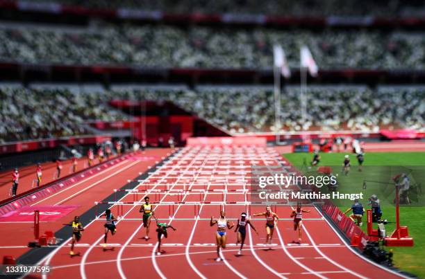 Jasmine Camacho-Quinn of Team Puerto Rico celebrates as she finishes first ahead of Kendra Harrison of Team United States in the Women's 100m Hurdles...