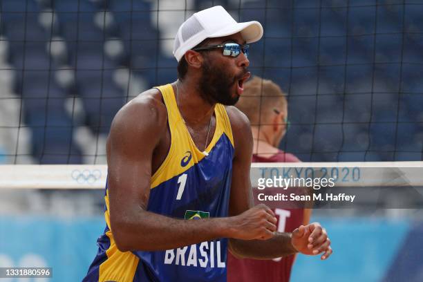 Evandro Goncalves Oliveira Junior of Team Brazil celebrates after the play against Team Latvia during the Men's Round of 16 beach volleyball on day...
