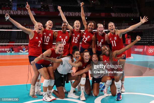 Team United States poses for a photo after defeating Team Italy during the Women's Preliminary - Pool B volleyball on day ten of the Tokyo 2020...