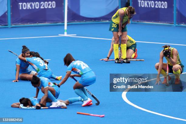 Navneet Kaur, Neha Neha and Lalremsiami of Team India celebrate their 1-0 win with teammates while Karri Somerville reacts after the Women's...