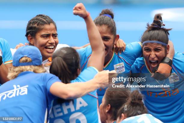 Navneet Kaur and Navjot Kaur of Team India celebrate their 1-0 win with teammates after the Women's Quarterfinal match between Australia and India on...