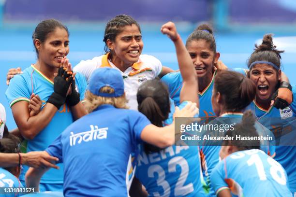 Navneet Kaur and Navjot Kaur of Team India celebrate their 1-0 win with teammates after the Women's Quarterfinal match between Australia and India on...