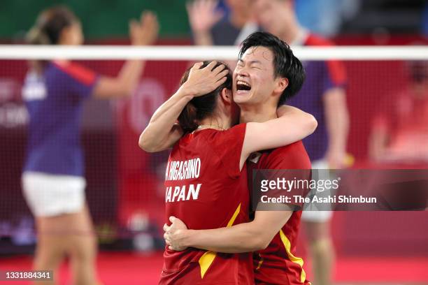 Arisa Higashino and Yuta Watanabe of Team Japan celebrate winning the bronze after their victory in the Mixed Doubles bronze medal match against Tse...