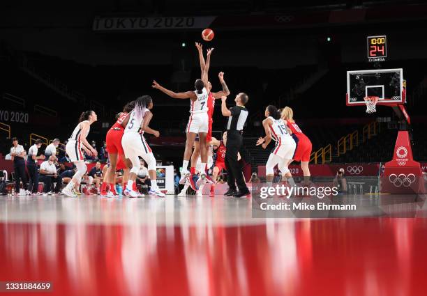 Sandrine Gruda of Team France tips off against Brittney Griner of Team United States during the first half of a Women's Basketball Preliminary Round...