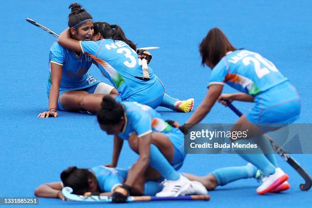 Navneet Kaur, Neha Neha and Lalremsiami of Team India celebrate their 1-0 win with teammates while Karri Somerville reacts after the Women's...