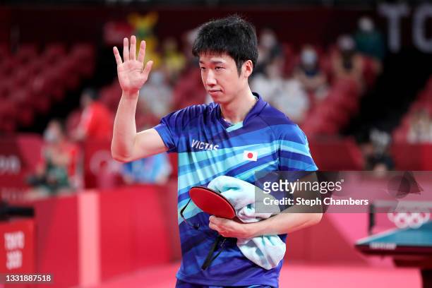 Jun Mizutani of Team Japan waves following his Men's Team Round of 16 table tennis match on day ten of the Tokyo 2020 Olympic Games at Tokyo...
