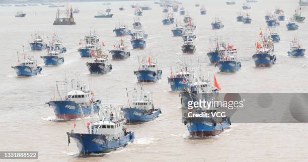 Fishing boats set sail from port in Zhoushan for East China Sea for fishing on August 1, 2021 in Zhoushan, Zhejiang Province of China.