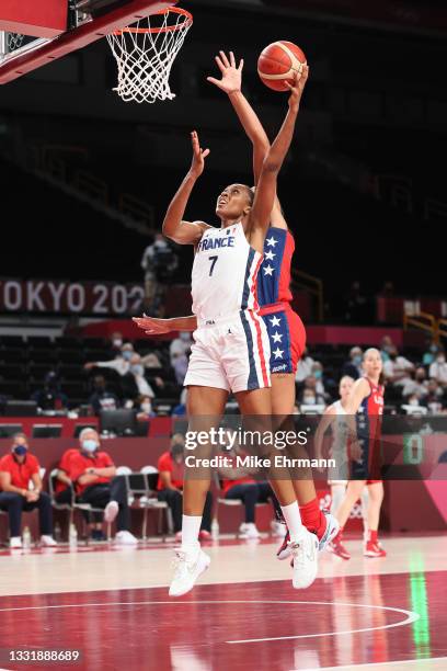 Sandrine Gruda of Team France goes up for a shot against against United States of America during the second half of a Women's Basketball Preliminary...