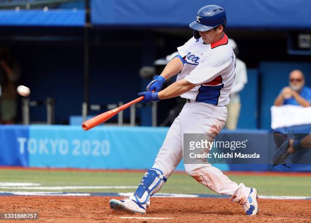 Hyunsoo Kim of Team South Korea hits a two-run home run in the fifth inning against Team Israel during the knockout stage of men's baseball on day...