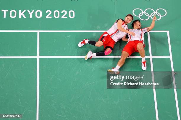 Greysia Polii and Apriyani Rahayu of Team Indonesia celebrate as they win against Chen Qing Chen and Jia Yi Fan of Team China during the Women’s...