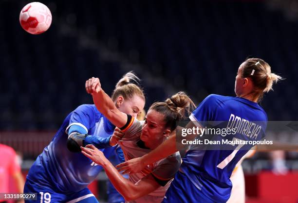 Nerea Pena Abaurrea of Team Spain shoots at goal while being challenged by Kseniia Makeeva and Daria Dmitrieva of Team ROC during the Women's...