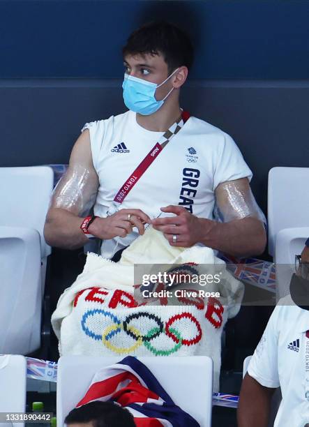 Tom Daley of Team Great Britain knits during the Men's 3m Springboard Preliminary Round on day ten of the Tokyo 2020 Olympic Games at Tokyo Aquatics...