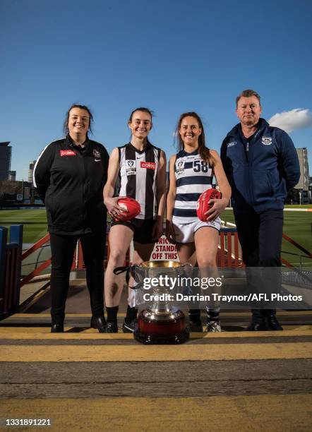Collingwood VFLW Coach Chloe McMillan and captain Caitlin Bunker pose for a photo with Geelong VFLW captain Breanna Beckley and Coach Andrew Bruce...
