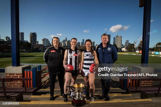 Collingwood VFLW Coach Chloe McMillan and captain Caitlin Bunker pose for a photo with Geelong VFLW captain Breanna Beckley and Coach Andrew Bruce...