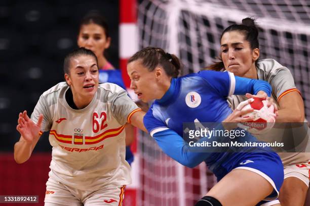Paula Arcos Poveda and Lara Gonzalez Ortega of Team Spain challenge Polina Vedekhina of Team ROC during the Women's Preliminary Round Group B...