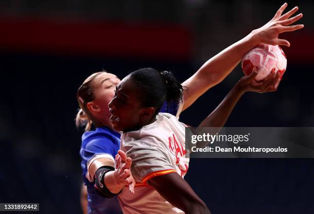 Alexandrina Cabral Barbosa of Team Spain shoots at goal while under pressure from Daria Dmitrieva of Team ROC during the Women's Preliminary Round...