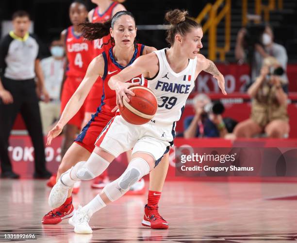 Alix Duchet of Team France drives to the basket against Sue Bird of Team United States during the second half of a Women's Basketball Preliminary...
