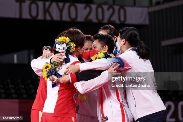 Silver medalists Chen Qing Chen and Jia Yi Fan of Team China, gold medalists Greysia Polii and Apriyani Rahayu of Team Indonesia and bronze medalists...