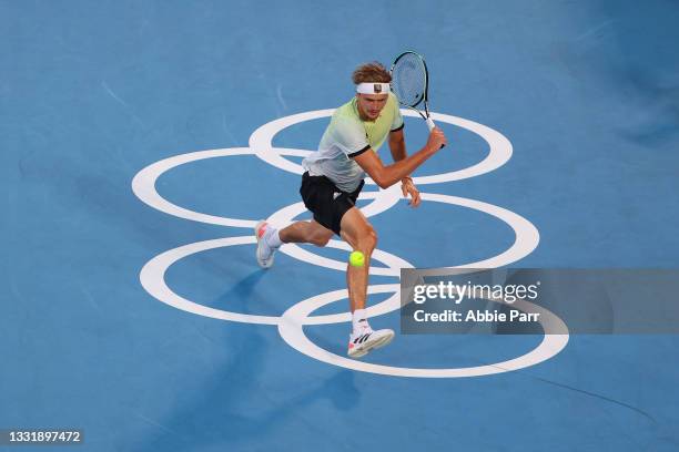 Alexander Zverev of Team Germany hits a backhand against Karen Khachanov of Team Russian Olympic Committee during the Men's Singles Gold Medal Match...