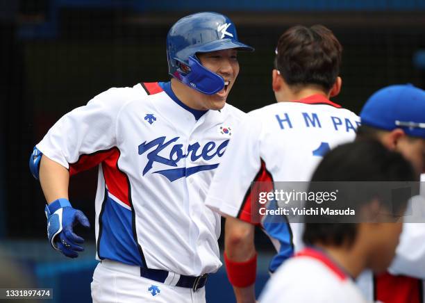 Hyunsoo Kim of Team South Korea celebrates with teammates after hitting a two-run home run in the fifth inning against Team Israel during the...
