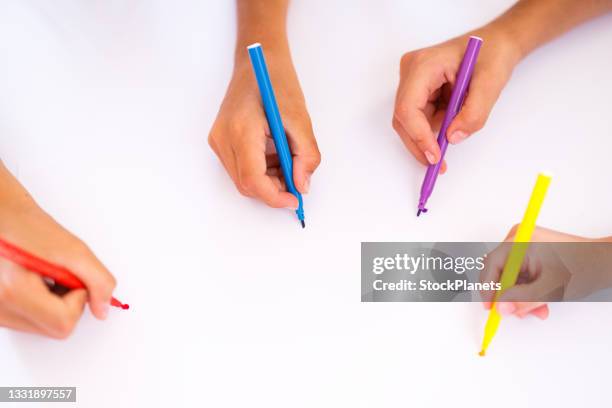 close-up of children drawing whit felt tip pens - coloring crayons stock pictures, royalty-free photos & images