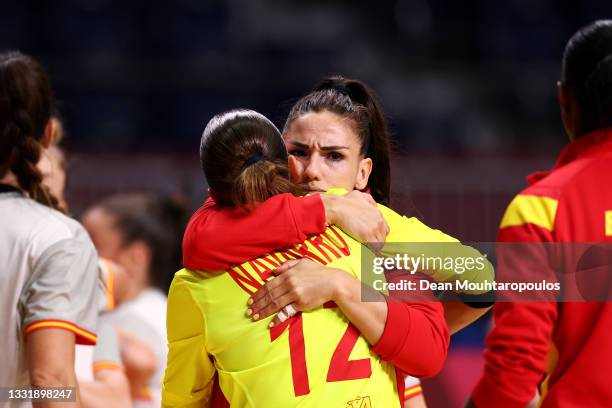 Carmen Dolores Martin Berenguer of Team Spain embraces teammate Silvia Navarro Gimenez after losing the Women's Preliminary Round Group B handball...