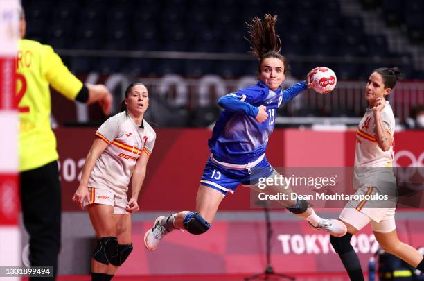 Anna Vyakhireva of Team ROC shoots for goal at Silvia Navarro Gimenez of Team Spain during the Women's Preliminary Round Group B handball match...