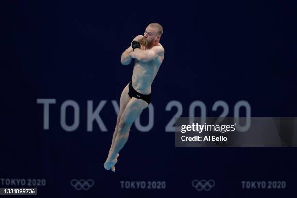 Evgenii Kuznetsov of Team ROC competes in the Men's 3m Springboard Preliminary Round on day ten of the Tokyo 2020 Olympic Games at Tokyo Aquatics...