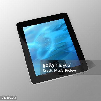 Tablets PC on grey floor Tablets PC on grey floor