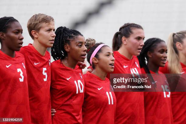 Kadeisha Buchanan, Quinn, Ashley Lawrence, Desiree Scott, Vanessa Gilles and Nichelle Prince of Team Canada stand for the national anthem prior to he...