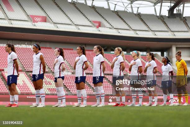 Players of Team United States stand for the national anthem prior to the Women's Semi-Final match between USA and Canada on day ten of the Tokyo...