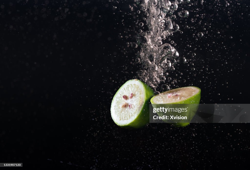 Lemon fell into water captured with high speed sync."n