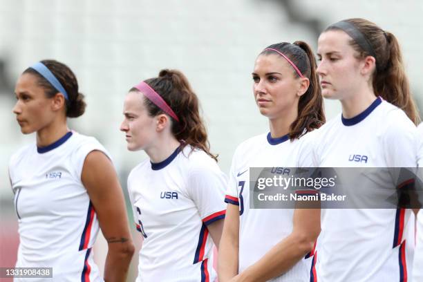 Alex Morgan of Team United States stands for the national anthem prior to the Women's Semi-Final match between USA and Canada on day ten of the Tokyo...
