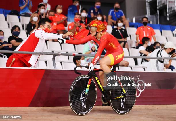Shanju Bao of Team China celebrates winning the gold medal during the Women's team sprint finals, gold medal of the Track Cycling on day 10 of the...
