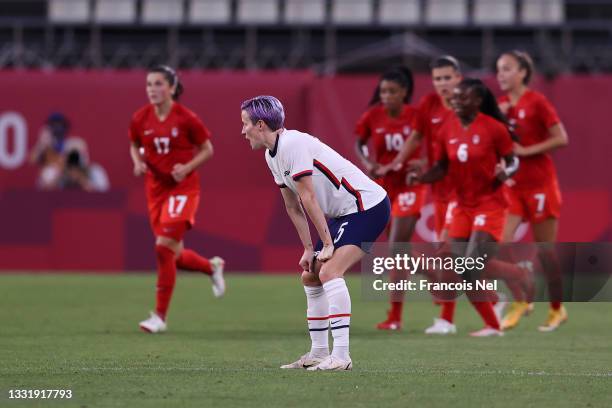 Megan Rapinoe of Team United States looks dejected after their side concedes a goal scored by Jessie Fleming of Team Canada during the Women's...