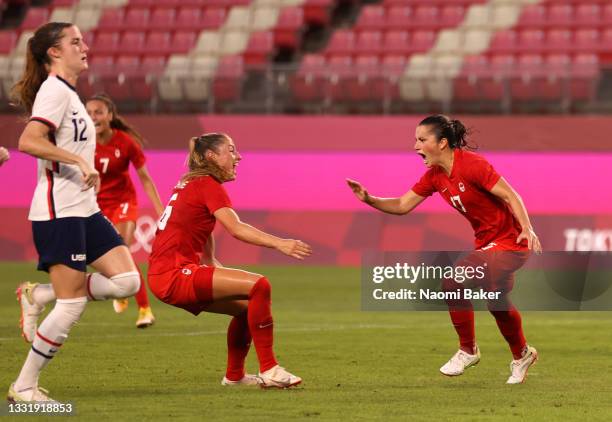 Jessie Fleming of Team Canada celebrates after scoring their side's first goal during the Women's Semi-Final match between USA and Canada on day ten...