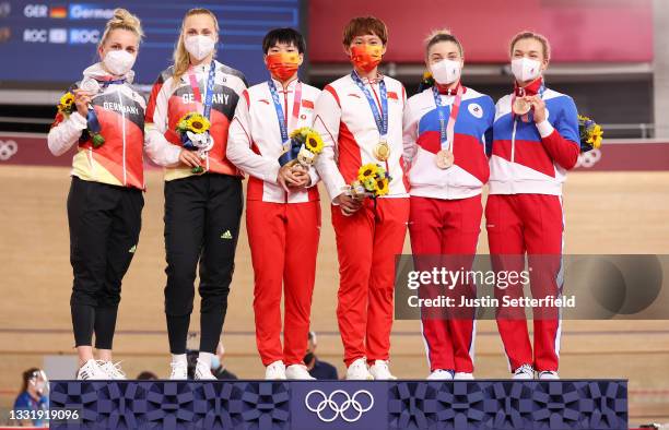 Silver medalists Emma Hinze and Lea Sophie Friedrich of Team Germany, gold medalists Shanju Bao and Tianshi Zhong of Team China, and bronze medalists...