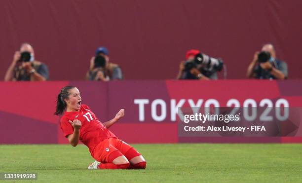 Jessie Fleming of Team Canada celebrates after scoring their side's first goal from the penalty spot during the Women's Semi-Final match between USA...