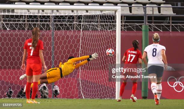 Adrianna Franch of Team United States fails to save a penalty from Jessie Fleming of Team Canada as she goes on to score her side's first goal during...