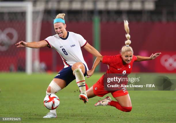 Julie Ertz of Team United States battles for possession with Adriana Leon of Team Canada during the Women's Semi-Final match between USA and Canada...