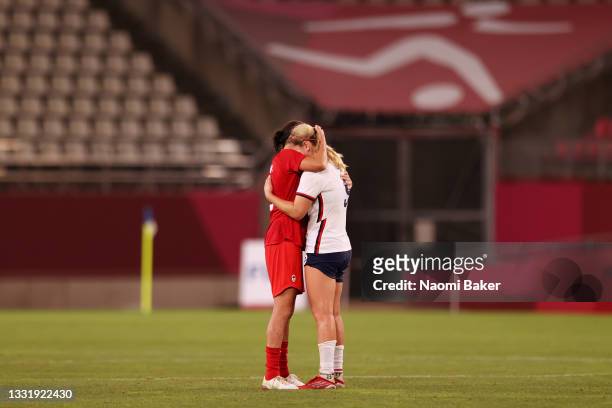 Lindsey Horan of Team United States is consoled by Vanessa Gilles of Team Canada after the Women's Semi-Final match between USA and Canada on day ten...