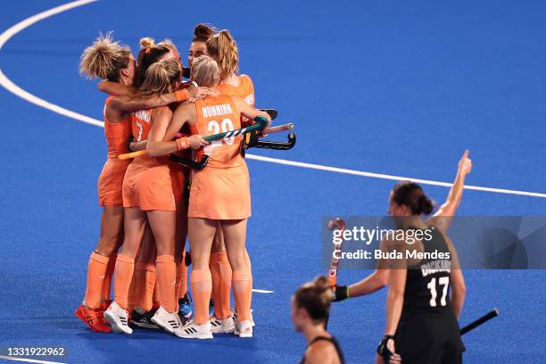 Frederique Matla of Team Netherlands celebrates with teammates after scoring their team's second goal from a penalty stroke during the Women's...