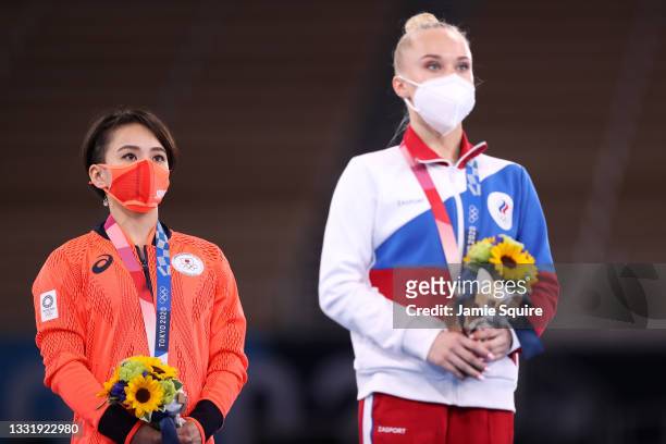 Mai Murakami of Team Japan and Angelina Melnikova of Team ROC look on following the Women's Floor Exercise Final on day ten of the Tokyo 2020 Olympic...