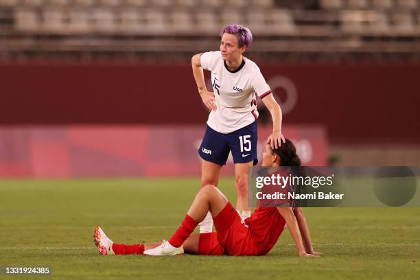 Megan Rapinoe of Team United States interacts with Christine Sinclair of Team Canada after the Women's Semi-Final match between USA and Canada on day...