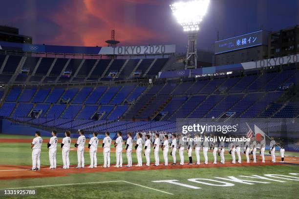 Team Japan and Team United States line up for national anthems prior to the knockout stage of men's baseball on day ten of the Tokyo 2020 Olympic...