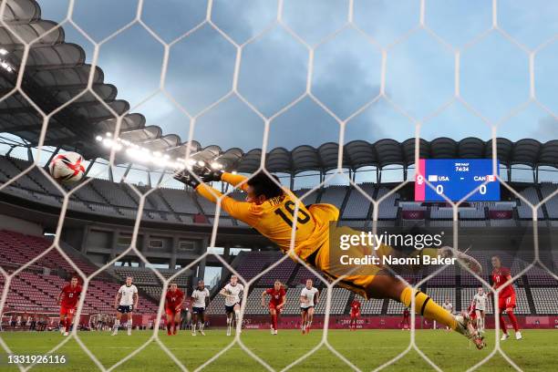 Adrianna Franch of Team United States fails to save a penalty from Jessie Fleming of Team Canada as she goes on to score her side's first goal during...