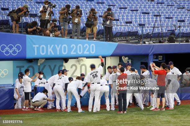 Team Japan huddles before their game against Team United States during the knockout stage of men's baseball on day ten of the Tokyo 2020 Olympic...