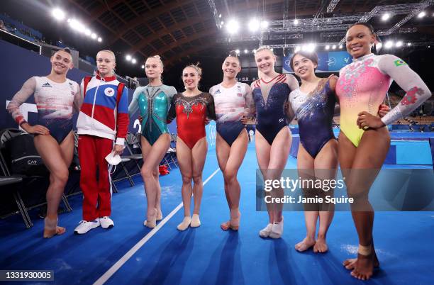 From left - Jessica Gadirova of Team Great Britain, Viktoriia Listunova and Angelina Melnikova of Team ROC, Vanessa Ferrari of Team Italy, Jennifer...